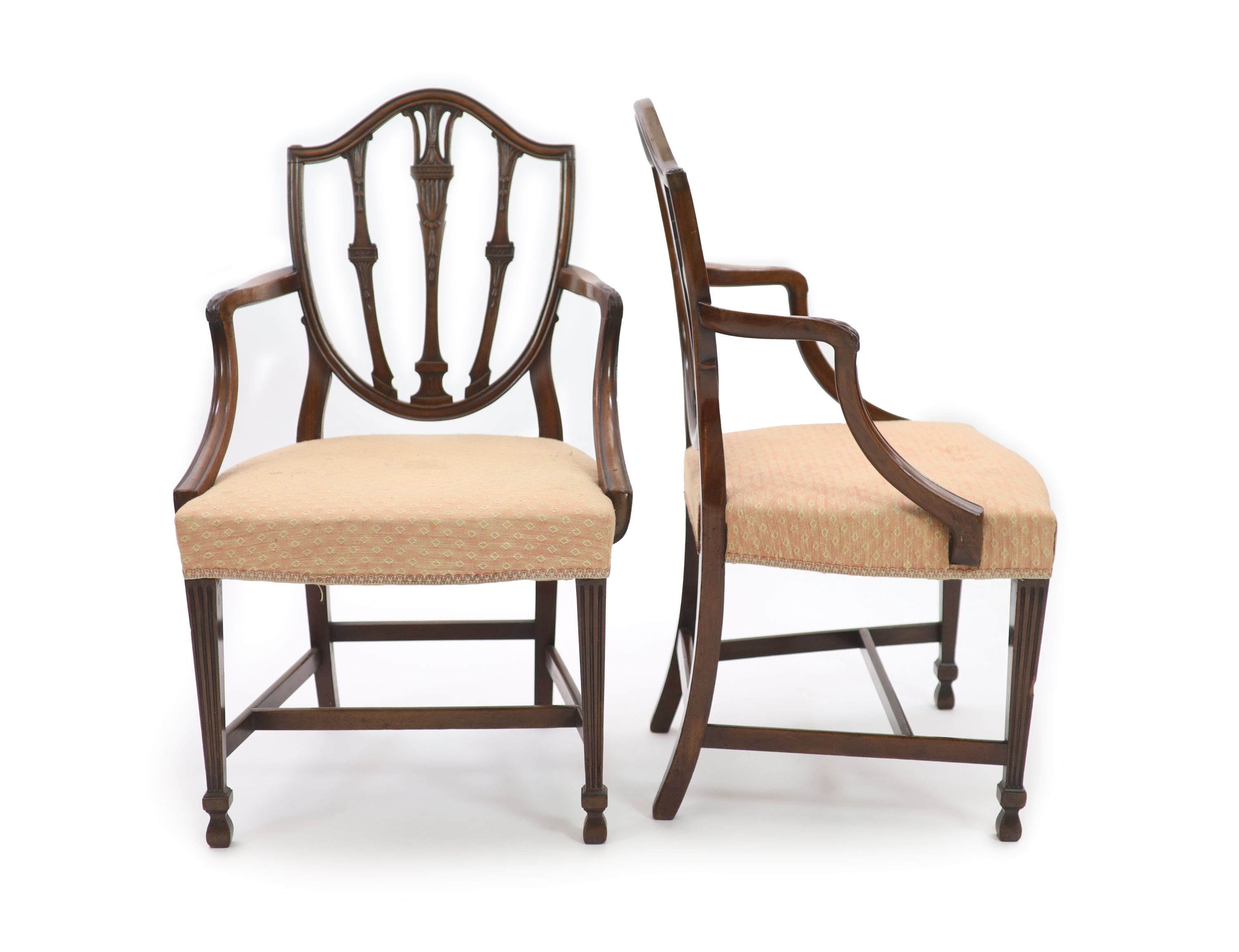 A pair of George III Hepplewhite style mahogany shield back elbow chairs, W.62cm H.97cm